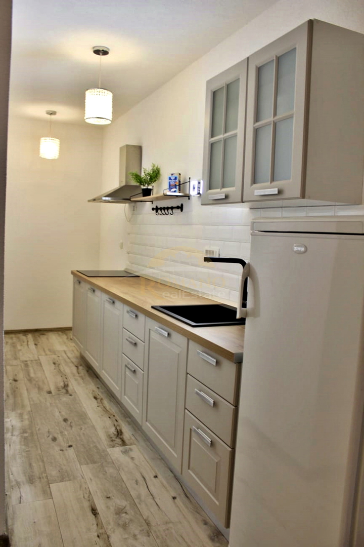 Stanovanje v pritličju s teraso in parkirnim mestom v garaži